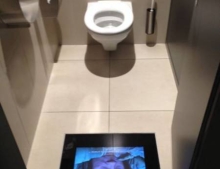 If you have to use the bathroom at this theater in Switzerland you won't have to worry about missing parts of the movie.
