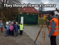 Kids thought this land surveyor was taking a picture.