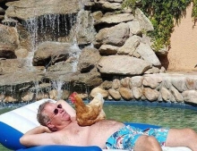 Man chillin' in the pool with his cock out.