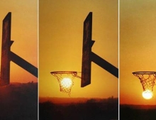 The sun playing a game of hoops drills a 3 pointer from down town.