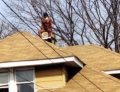 This man appears to be taking a dump down someones chimney. I wonder if it was even Christmas?