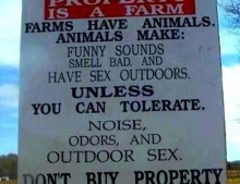 Sign for those city slickers looking to buy property next to a farm.