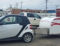 Smartcar pulling a teardrop trailer is a great camping set up for the less is more crowd.
