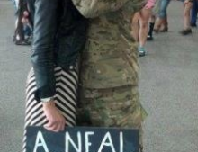 Soldier returns from duty and is greeted with the best welcome home sign ever.