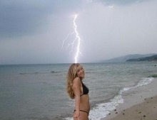 Beach hottie in bikini gets nailed by lightning strike.