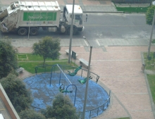 These garbage men decided to take a break and have a little fun on some playground swings.