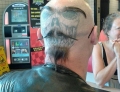 This Guy Adds An Extra Sense Of Style To His Back Of The Head Tattoo.
