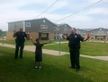 Two white police officers held at gunpoint by black kid.