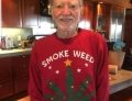 Willie Nelson receives Christmas sweater from Snoop Dogg.