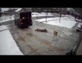 UPS driver conquers the ice with a perfect package delivery.