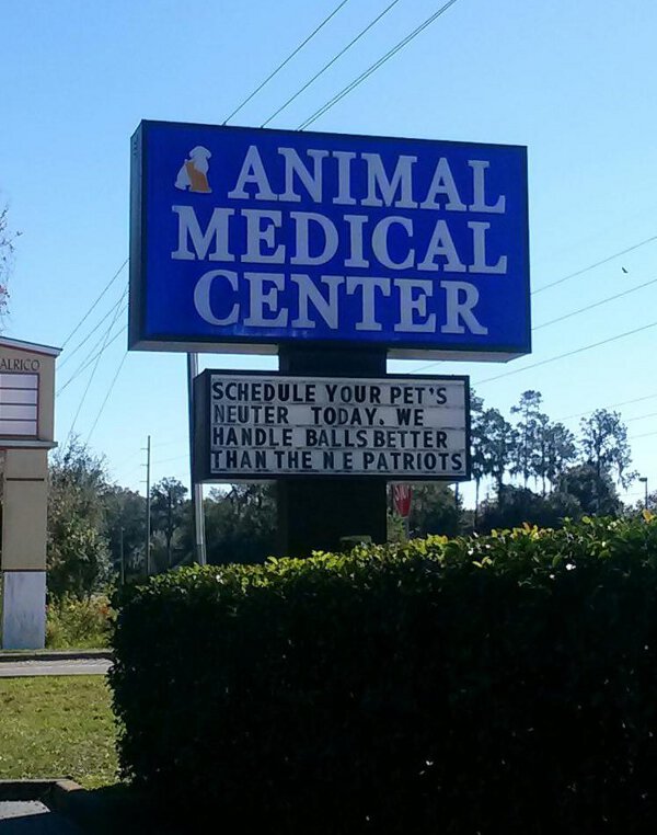 Animal Medical Center sign encouraging people to get their pets neutered by them due to their fabulous ball handling skills.