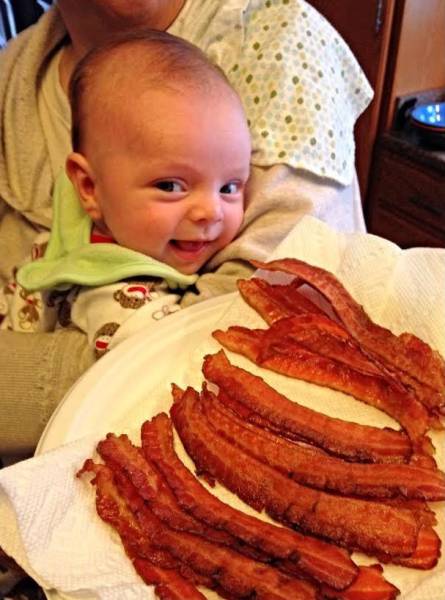 This baby is already a bacon lover.