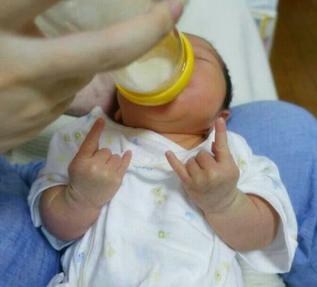 This Baby Rocks Out While Enjoying Some Milk.