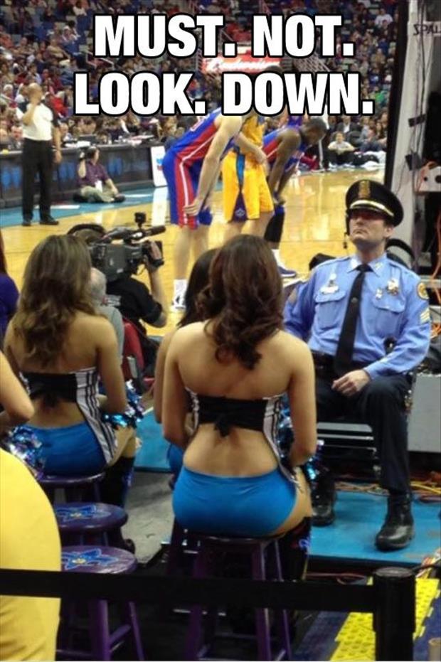 This Police Officer Must Watch Over The Crowd To Keep Everyone Safe But He Has A Few Major Distractions Directly In Front Of Him.