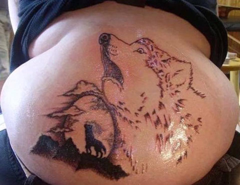This wolf tattoo looks horrified.